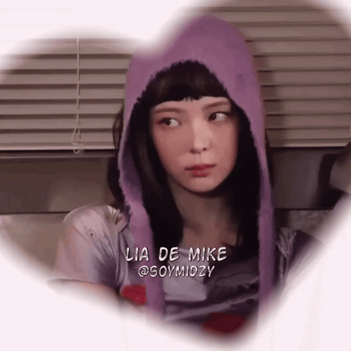 A Woman Wearing A Purple Hoodie With Lia De Mike @Soymidzy Written On The Bottom GIF