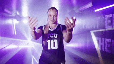 A Woman Wearing A Purple Jersey With The Number 10 GIF