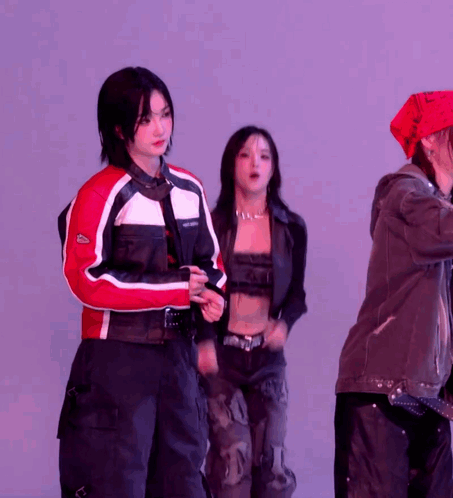 A Woman Wearing A Red And White Jacket With The Word Lacoste On The Front GIF