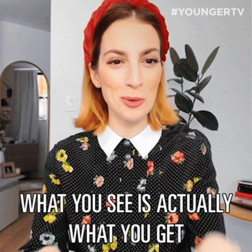 A Woman Wearing A Red Headband And A Polka Dot Shirt Says What You See Is Actually What You Get GIF