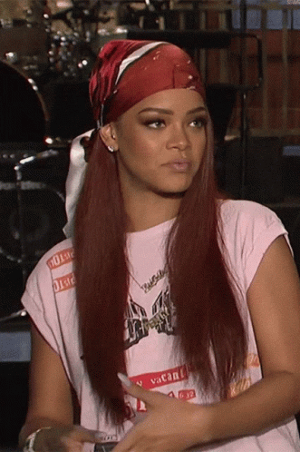 A Woman Wearing A Red Headband And A Vacant Shirt GIF