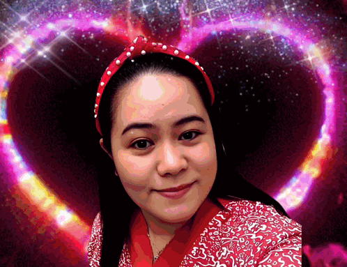 Woman With Red Headband Smiling In Front Of Heart GIF