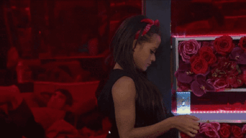 A Woman Wearing A Red Headband That Says ' I Love You ' GIF