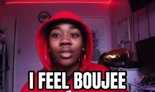 A Woman Wearing A Red Hoodie Says " I Feel Boujee " GIF