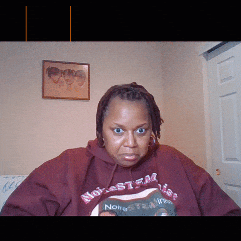 A Woman Wearing A Red Hoodie That Says Noire GIF