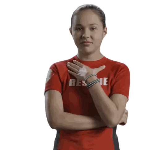 a woman wearing a red rescue shirt holds her hand to her chest
