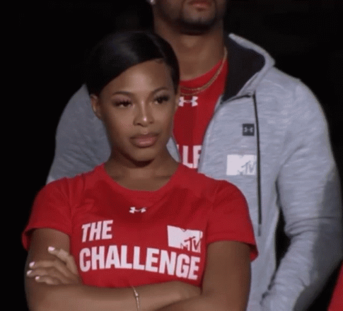 A Woman Wearing A Red Shirt That Says The Challenge On It GIF