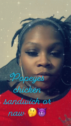 A Woman Wearing A Red Shirt With Popeye 'S Chicken Sandwich Or Naw Written On It GIF