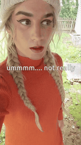 A Woman Wearing A Red Sweater And A White Hat Says " Ummm ... Not Really " GIF