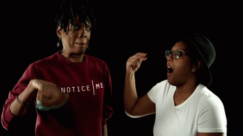 A Woman Wearing A Red Sweater That Says Notice Me On It GIF