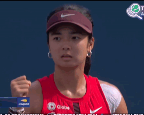 A Woman Wearing A Red Tank Top With Globe Written On It GIF