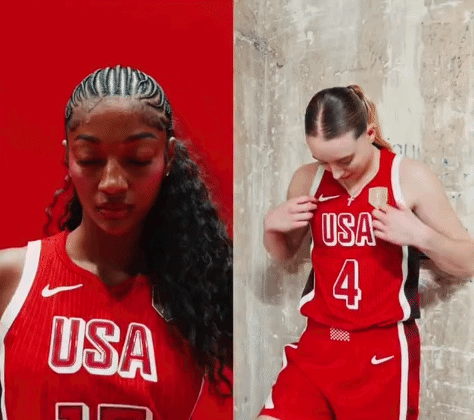 a woman wearing a red usa basketball jersey