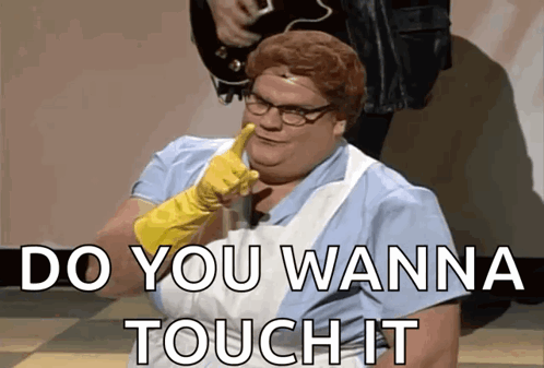 A Woman Wearing A Rubber Glove Says " Do You Wanna Touch It " In Front Of A Man Playing A Guitar GIF