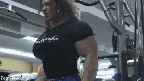 A Woman Wearing A Shirt That Says Femflex.com On It GIF