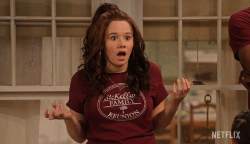 A Woman Wearing A Shirt That Says It Kelly Family Reunion Looks Surprised GIF