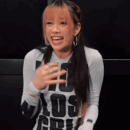 A Woman Wearing A Shirt That Says Los Angeles GIF