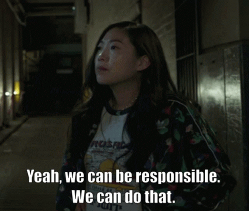 A Woman Wearing A Shirt That Says Yeah We Can Be Responsible GIF