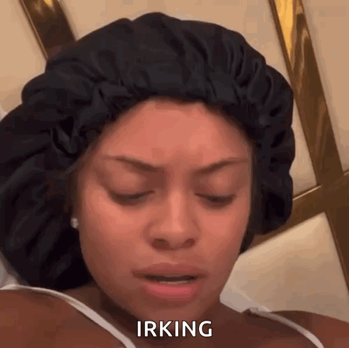 A Woman Wearing A Sleep Cap Is Making A Funny Face And Saying Irving . GIF