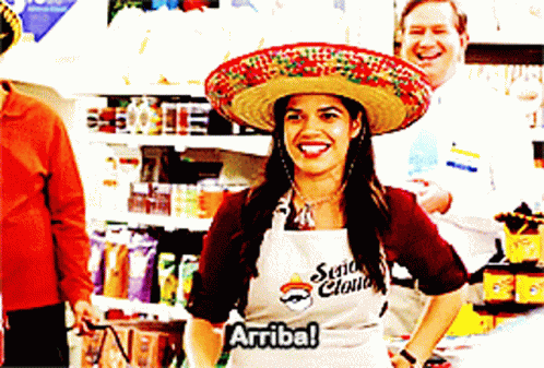 A Woman Wearing A Sombrero And An Apron That Says ' Señor Claus ' GIF