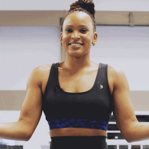 A Woman Wearing A Sports Bra With The Letter A On The Front GIF