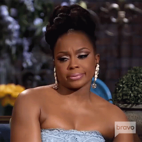 A Woman Wearing A Strapless Dress And Earrings Is On Bravo Television GIF
