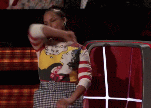 A Woman Wearing A Sweater That Says ' I 'M Sorry ' On It GIF