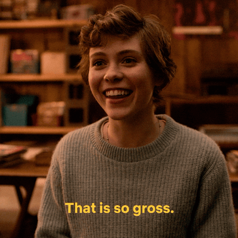 A Woman Wearing A Sweater That Says That Is So Gross On It GIF