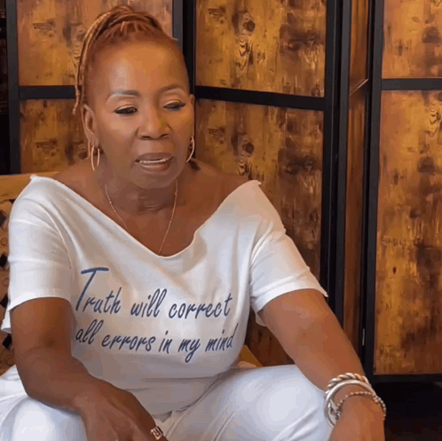 A Woman Wearing A T-Shirt That Says Truth Will Correct All Errors In My Mind GIF