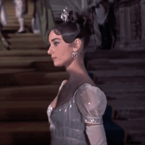 Woman In Tiara And Gloves On Stairs GIF