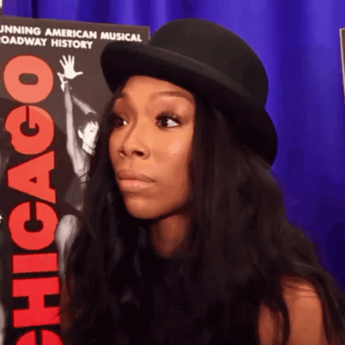 Woman In Top Hat In Front Of Chicago Poster GIF
