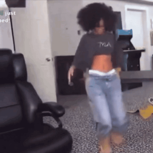 A Woman Wearing A Tyla Crop Top Is Dancing GIF