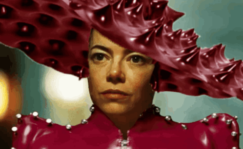 a woman wearing a very large red hat