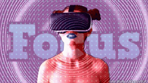 A Woman Wearing A Virtual Reality Headset With The Word Focus Written In The Background GIF