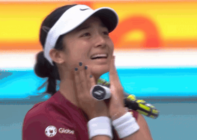 A Woman Wearing A Visor And A Shirt That Says Globo GIF