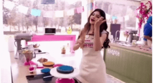 Woman Wearing Bake Off Apron GIF