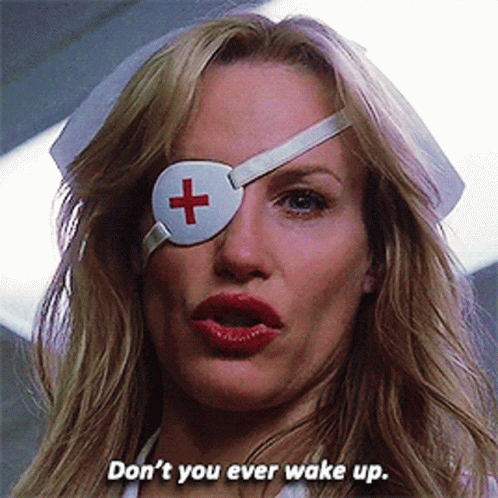 A Woman Wearing A White Eye Patch With A Red Cross On It Says Don 'T You Ever Wake Up GIF