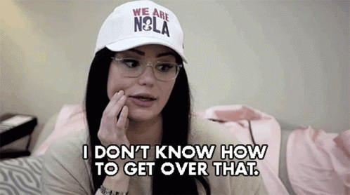A Woman Wearing A White Hat That Says " We Are Nola " GIF