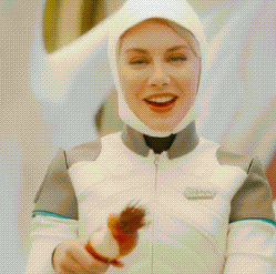 A Woman Wearing A White Helmet And A White Jacket Is Smiling GIF