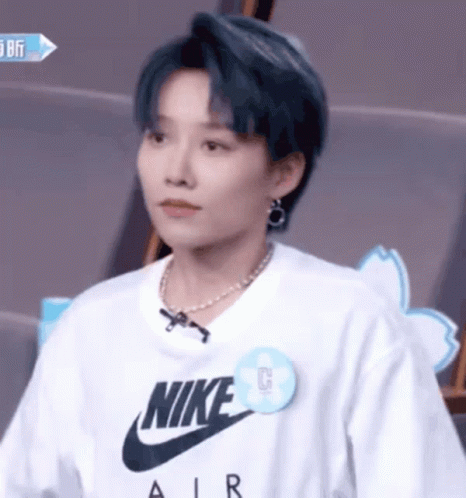 A Woman Wearing A White Nike Air T Shirt GIF