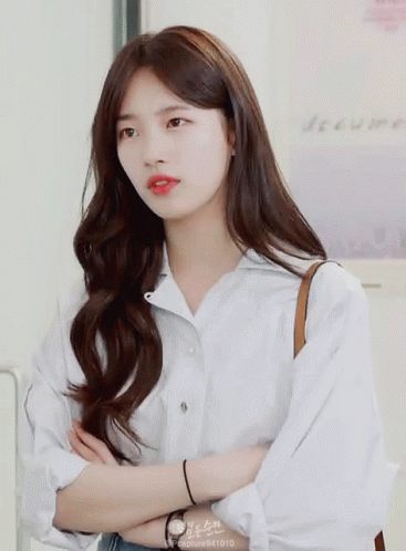 A Woman Wearing A White Shirt Has The Number 941010 On Her Sleeve GIF