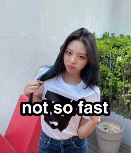 a woman wearing a white shirt that says not so fast on it