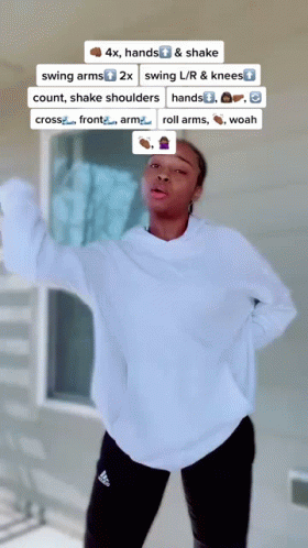 Woman In White Sweatshirt And Black Adidas Pants GIF
