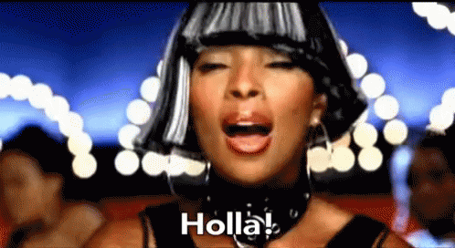 A Woman Wearing A Wig Is Singing Holla ! GIF