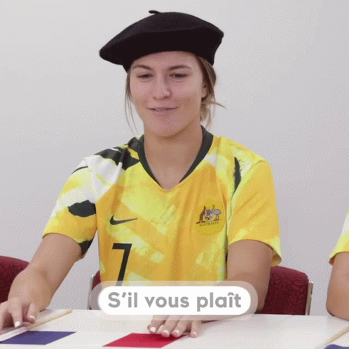 A Woman Wearing A Yellow Jersey With The Number 7 GIF