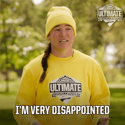 A Woman Wearing A Yellow Shirt That Says Canada 'S Ultimate Challenge GIF