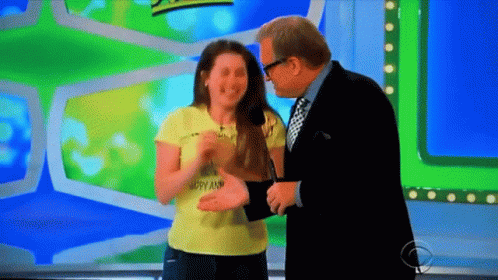 A Woman Wearing A Yellow Shirt That Says Happy And Laughing With A Man GIF