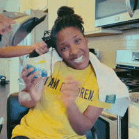 A Woman Wearing A Yellow Shirt That Says " I Am Sore " GIF