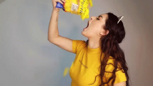 A Woman Wearing A Yellow Shirt That Says New Hood On It GIF