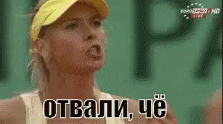 A Woman Wearing A Yellow Visor Is Making A Funny Face While Talking In Russian GIF