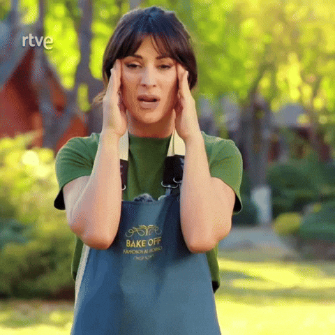 a woman wearing an apron that says bake off holds her head